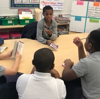 Student Antonio King meets with the book club at Amidon-Bowen Elementary School. The club is focused on improving literacy and a love of reading.