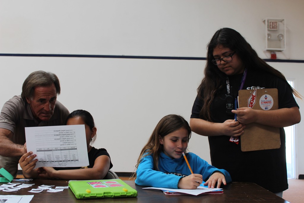 Luxy and Chris help kids with their homework