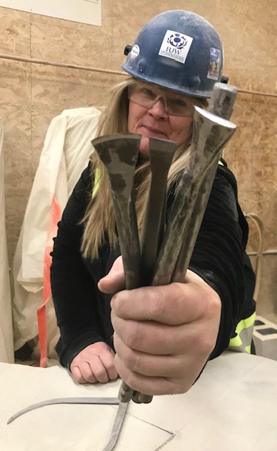 Stonemason Tina Hart with her tools of the trade Stonemason Tina Hart with tools of the trade.