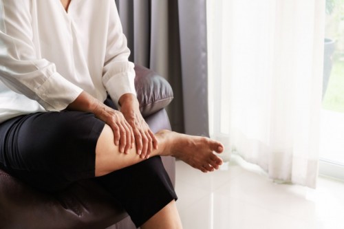 stock photo of a person with a leg cramp stock photo of a person with a leg cramp