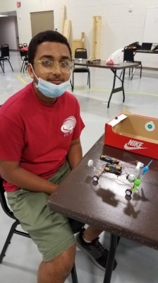 CCPREP 2021 Camper_Vihaan Rajput and winning vehicle design - Vihaan Rajput, who will start his freshman year at Veterans Memorial High School in August, poses with his battery-operated vehicle made from a plastic soda bottle. The 14-year-old is one of 37 CCPREP (Corpus Christi Prefreshman Engineering Program) 2021 participants and has spent much of the summer expanding his knowledge, understanding and skills in the STEM (science, technology, engineering and mathematics) during the annual six-week youth summer camp at Del Mar College. (Credit: DMC College Relations) CCPREP 2021 Camper_Vihaan Rajput and winning vehicle design