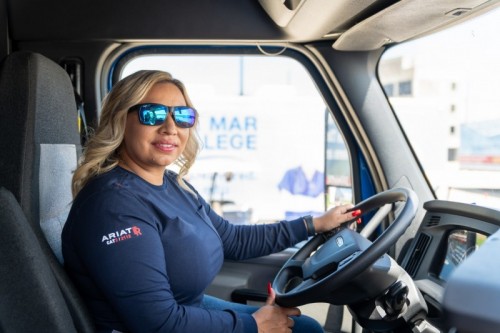 Ashley Leiva_Nov 2021 DMC Trucking Graduate_Behind the Big Wheel - U.S. Army veteran Ashley Leiva, a November 2021graduate of Del Mar College’s Transportation Training Services Program, sits behind the wheel of a “big rig.” After her mother passed away six months before Leiva planned to retire from military service, she and her brother took over the family business, Noemi Trucking, after Leiva separated from military life with a 15-year career that took her across the county and abroad. Currently, she is one of 11 and the only woman finalist for the 2022 Transition Trucking: Driving for Excellence Award presented by the U.S. Chamber of Commerce Foundation’s Hiring Our Heroes Program in collaboration with Kenworth and FASTPORT. The winner will be announced on Dec. 16. (Credit: CRO Digital Services) Ashley Leiva_Nov 2021 DMC Trucking Graduate_Behind the Big Wheel