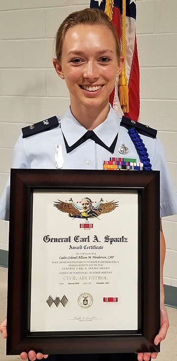 New colonel - Col. Allison Henderson holds her just-presented Gen. Carl A. Spaatz Award. New colonel