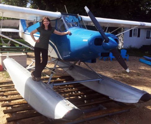 Seaplane scene - Maj. Karen Kalishek beside a seaplane. Seaplane scene