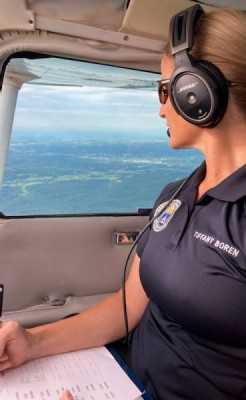 Water everywhere - Capt. Tiffany Boren of the Heartland Composite Squadron gazes down on flooded eastern Kentucky. Water everywhere