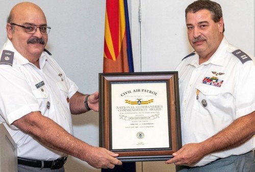 Job well done - Lt. Col. Bob Ditch (left) presents Capt. John A. Bryant with the National Commander's Citation on Dec. 6 for his contributions in leading 75 Operation Pulse Lift blood donor center events at the Arizona Wing's Falcon Composite Squadron 305 headquarters in Mesa. Bryant is deputy commander for seniors for the squadron, which helped collect 2,255 units of blood, potentially saving 6,765 lives. Job well done