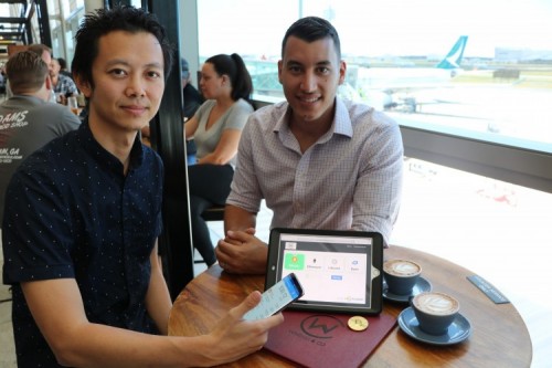 Caleb Yeoh from TravelbyBit and George Drivas Windmill & Co. try out the new cryptocurrency option at Brisbane Airport - Caleb Yeoh from TravelbyBit and George Drivas Windmill & Co. try out the new cryptocurrency option at Brisbane Airport