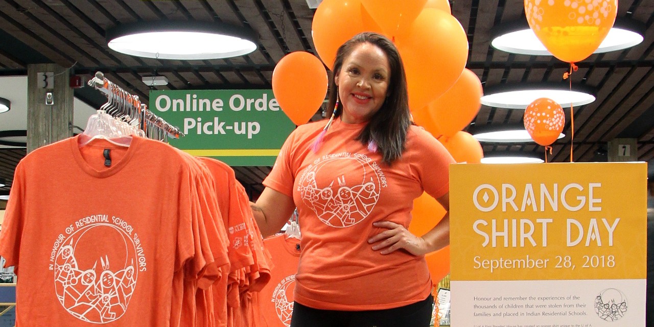 Shana Dion, assistant dean, First Nations, Métis and Inuit students, wears the orange shirt available from the U of A bookstore to help the university community commemorate Orange Shirt Day this Friday. Proceeds from the shirt sales will go toward cultural programming for Indigenous students at the U of A. (Photo: Sarah Coffin) Shana Dion, assistant dean, First Nations, Métis and Inuit students, wears the orange shirt available from the U of A bookstore to help the university community commemorate Orange Shirt Day this Friday. Proceeds from the shirt sales will go toward cultural programming for Indigenous students at the U of A. (Photo: Sarah Coffin)