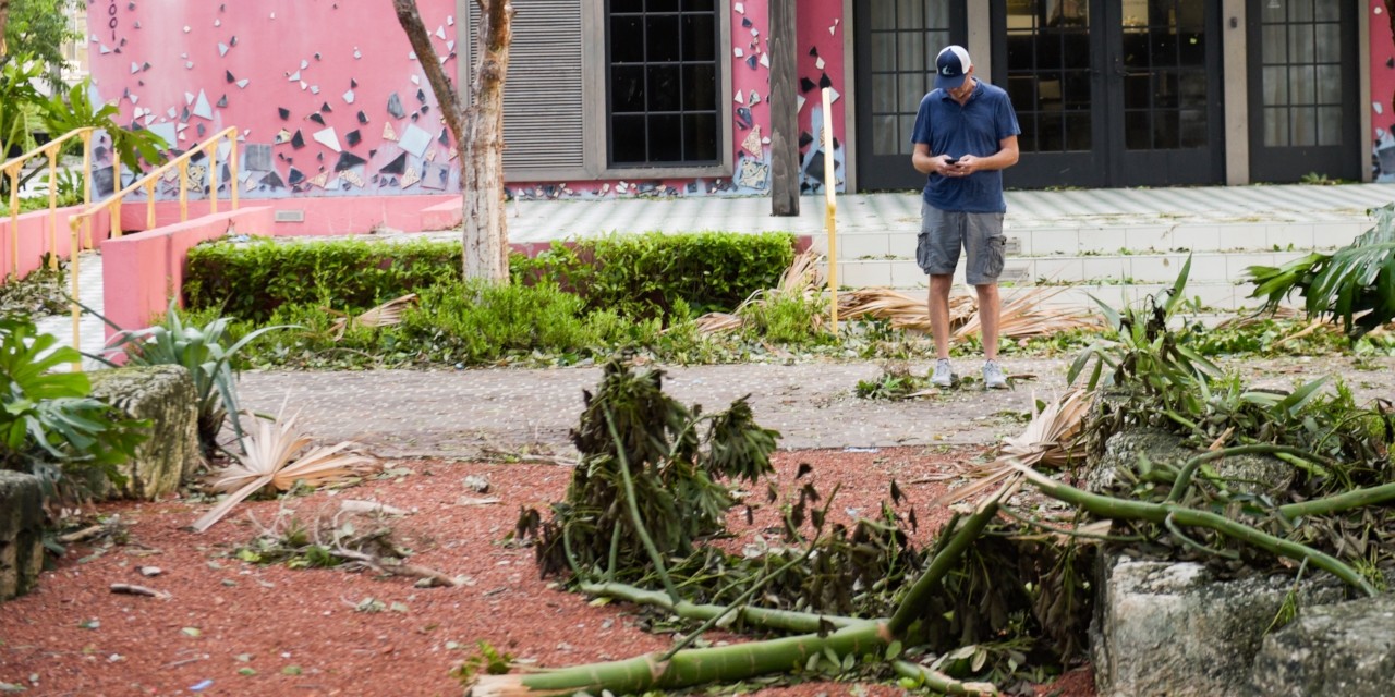 A man uses a smartphone after Hurricane Irma passed through South Florida in September 2017. U of A researchers found location-based social networks like Twitter provide data that could help relief organizations respond more quickly and allocate resources more efficiently during and after disasters. (Getty Images) A man uses a smartphone after Hurricane Irma passed through South Florida in September 2017. U of A researchers found location-based social networks like Twitter provide data that could help relief organizations respond more quickly and allocate resources more efficiently during and after disasters. (Getty Images)