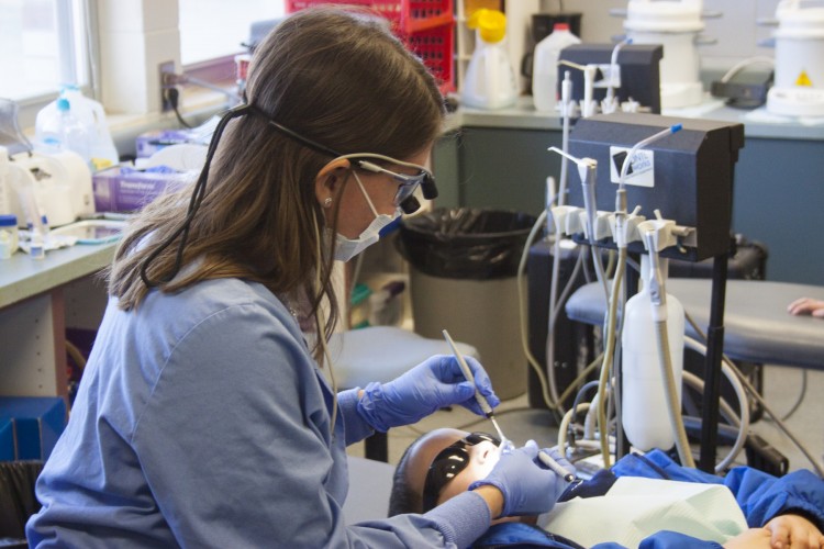 Dr. Mollie Day provides dental care to a patient at Heartland Community Health Center in Lawrence, Kansas.