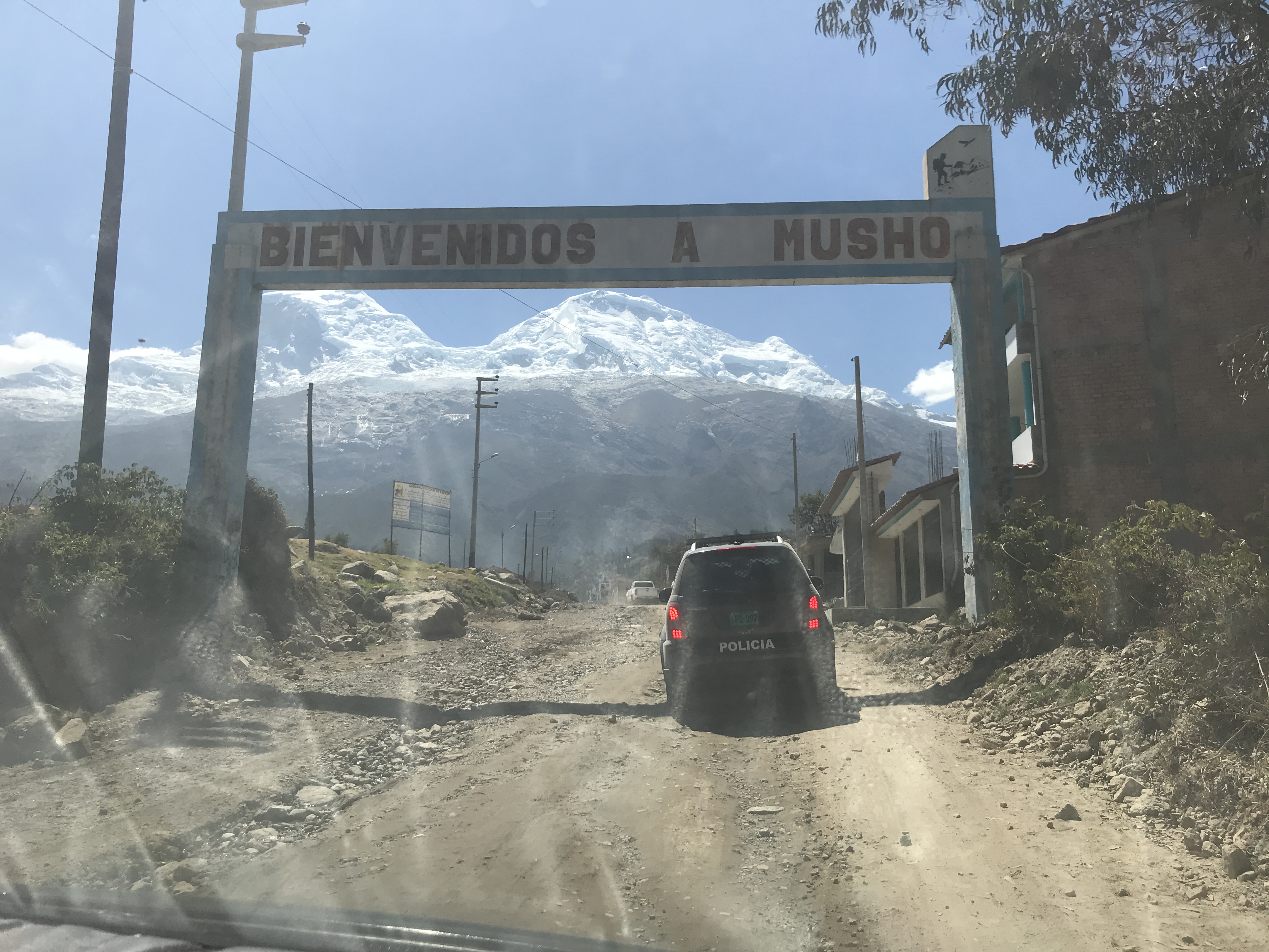 Science team members are escorted by local and national police to a town square meeting with protestors in Musho, Peru., on Aug. 11, 2019. Photo credit: Lonnie Thompson.