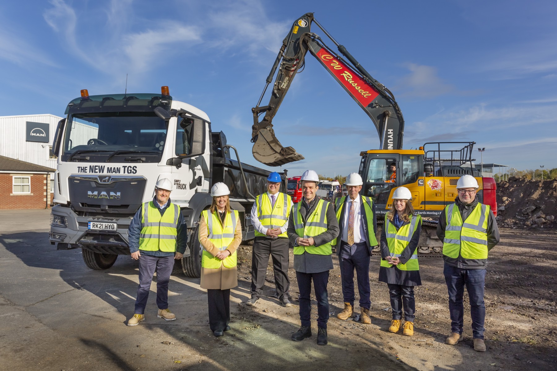 Groundworks commence, with the existing and fully functional Stockton-on-Tees site in the background. L to R - Roland Rands (General Sales Manager - North East) Catherine Brown (HR Director) Tony Johnson (General Manager MAN Truck & Bus Stockton) Stefan Thyssen (Managing Director of MAN Truck & Bus UK Ltd) David Littlejohn (Head of Branches UK) Eva Evans (Head of Network Development & Strategic Projects) Mitch Barnes (Network Business Development Manager). Groundworks commence, with the existing and fully functional Stockton-on-Tees site in the background. L to R - Roland Rands (General Sales Manager - North East) Catherine Brown (HR Director) Tony Johnson (General Manager MAN Truck & Bus Stockton) Stefan Thyssen (Managing Director of MAN Truck & Bus UK Ltd) David Littlejohn (Head of Branches UK) Eva Evans (Head of Network Development & Strategic Projects) Mitch Barnes (Network Business Development Manager).