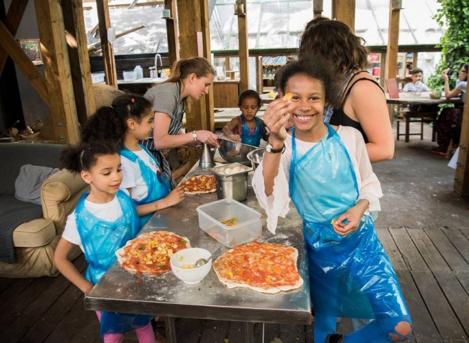 Making pizza in the Dalston Eastern Curve Garden pizza oven