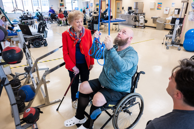Alana Shepherd visits patient Jeffrey Campbell on her daily rounds of greeting patients, staff, and family members.