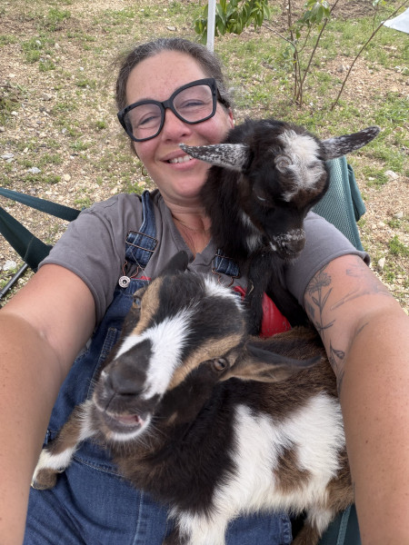Rachael Welch poses for a selfie with two of the family's bucklings.