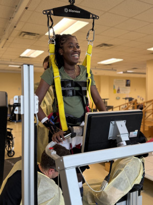 Teana Jackson using the treadmill for locomotor training.