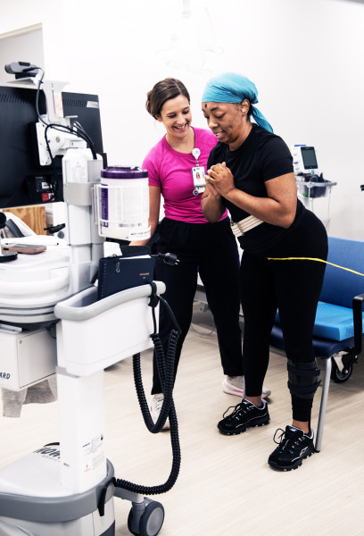 Hendria Moore, a participant in the MS Rehabilitation and Wellness Program, works on her strength and balance with physical therapist Ally Brainard