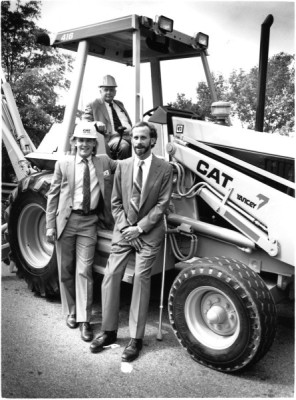 Architect Henry Howard Smith II (seated), James David Yancey, and James Shepherd visit the construction site during a 1980s renovation of Shepherd Center.