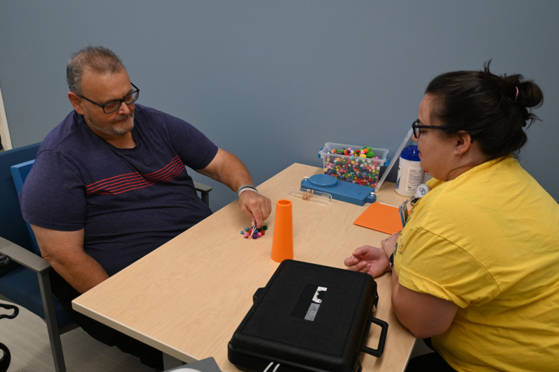 Rich LaFramboise participates in occupational therapy with his OT, Ella Thompson