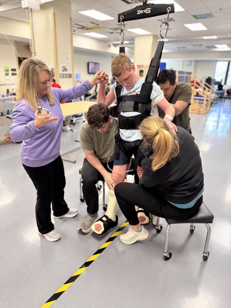 Ashlie Simpson holds her son Landon's hand while he uses the ZeroG.