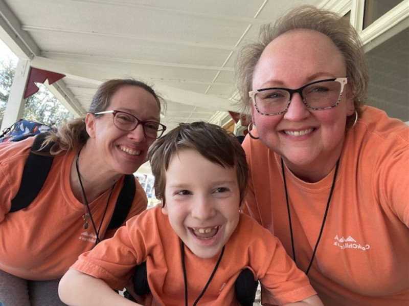 Alison and Carter Large with Cook Children's Volunteer at Camp ID