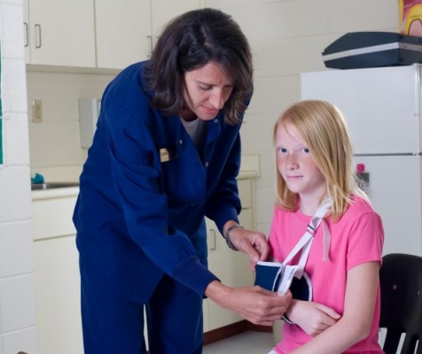 School Nurse And Student Patient