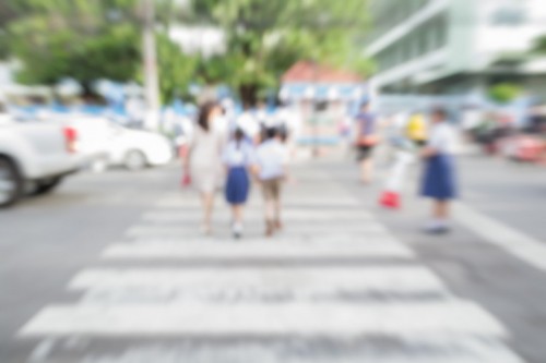 Blurred Schoolchild Walk Crossing The Street