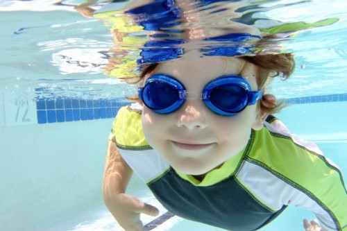 Child Swimming In Pool Underwater