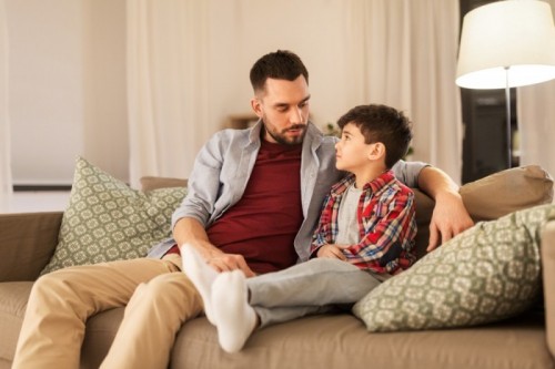 stock-photo-family-relationships-and-trust-concept-father-talking-to-his-sad-little-son-at-home-in-evening-1398231200.jpg