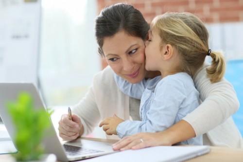 stock-photo-little-girl-giving-kiss-to-her-mom-while-working-from-home-231125680.jpg