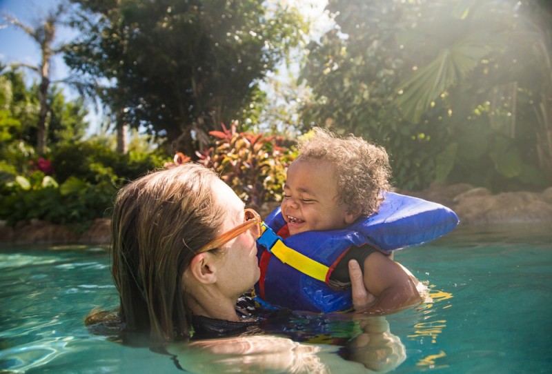 Boy and mom swimming