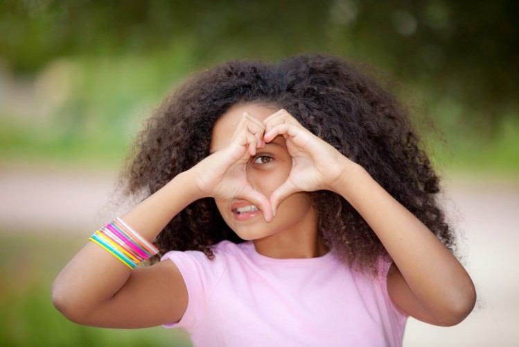 stock-photo-young-african-american-kid-making-heart-shape-with-hands-111405029.jpg
