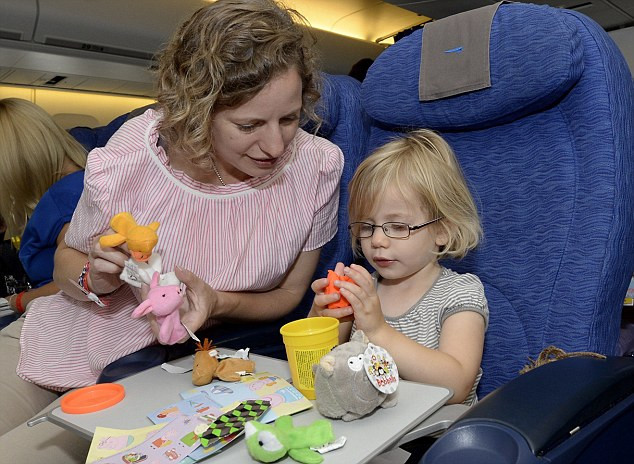 Kid with toys on plane