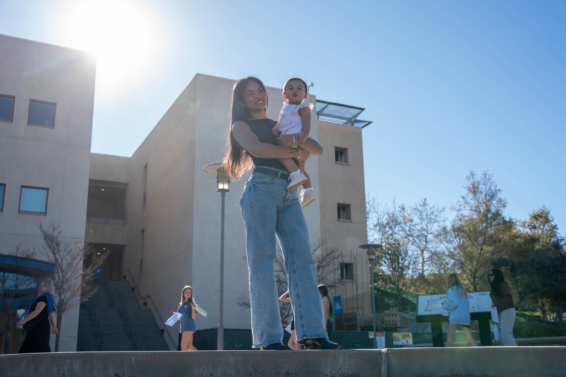 Cameron Aquino, with 1-year-old daughter Phoenix, graduated Monday with her bachelor's in psychological science. Photo by Amanda Vannucci Cameron Aquino, with 1-year-old daughter Phoenix, graduated Monday with her bachelor's in psychological science. Photo by Amanda Vannucci