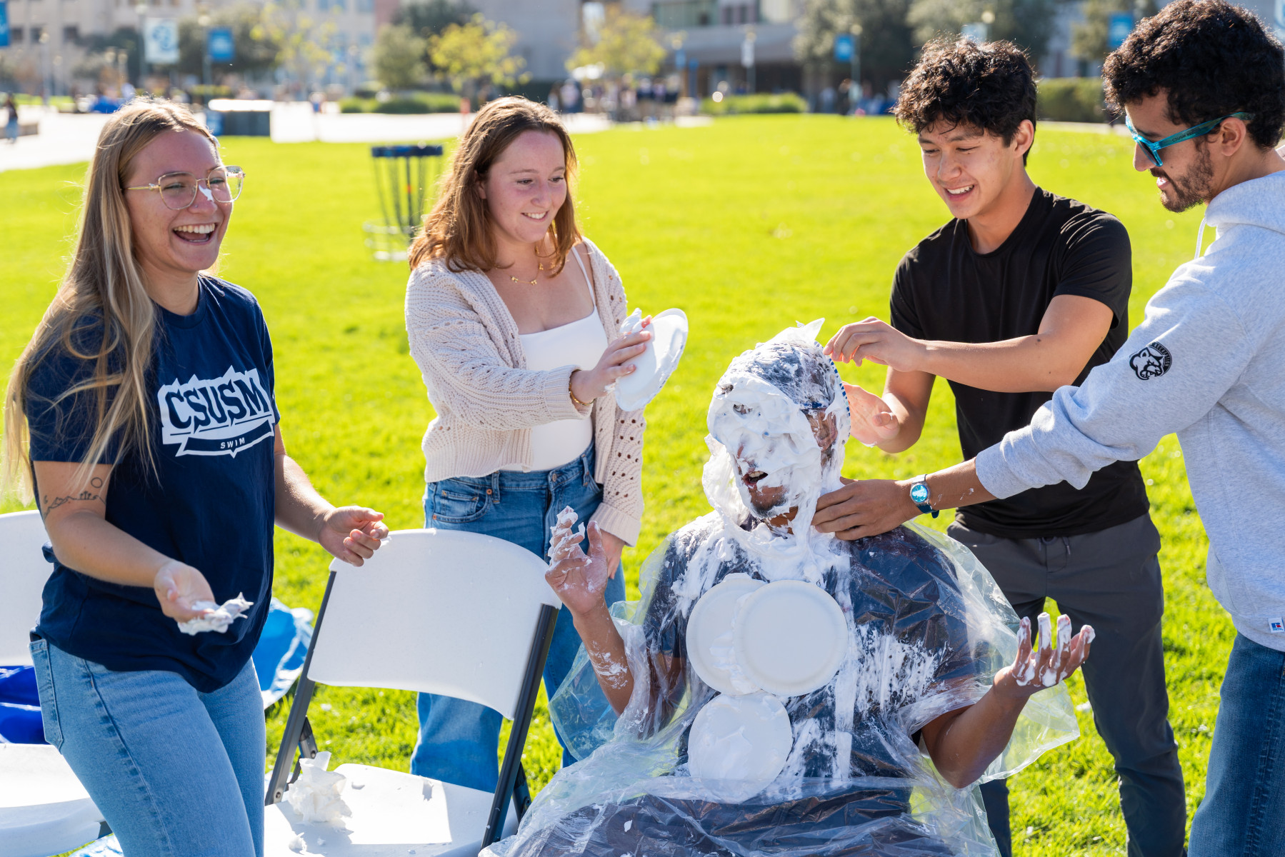 Students participate in a pie-throwing event as part of CSUSM Giving Day on Dec. 2. Photo by Brandon Pollard Students participate in a pie-throwing event as part of CSUSM Giving Day on Dec. 2. Photo by Brandon Pollard