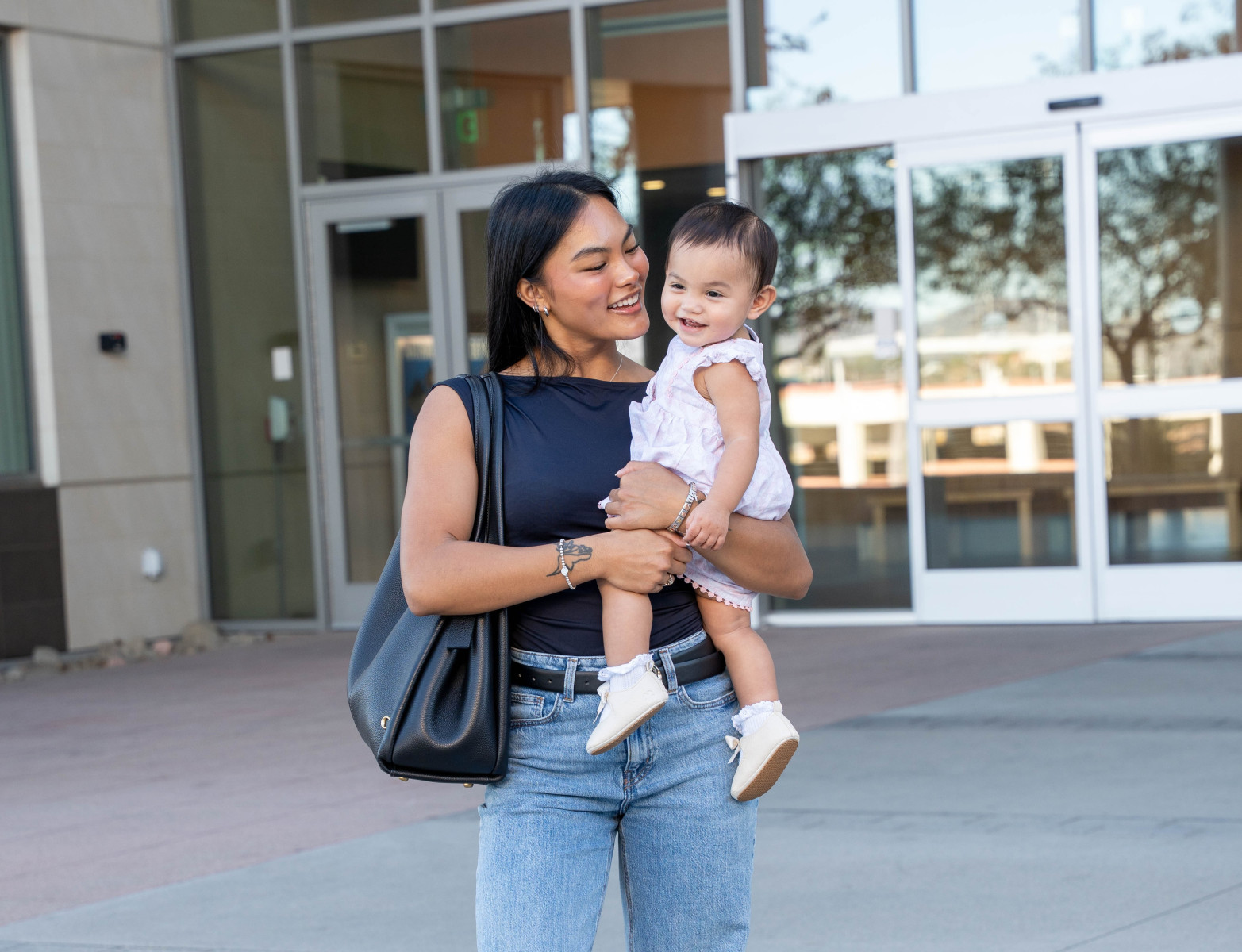 Cameron Aquino, with 1-year-old daughter Phoenix, says, “Since finding out I was pregnant, I knew I wasn’t going to fall. I knew I was going to keep going.” Photo by Amanda Vannucci Cameron Aquino, with 1-year-old daughter Phoenix, says, “Since finding out I was pregnant, I knew I wasn’t going to fall. I knew I was going to keep going.” Photo by Amanda Vannucci
