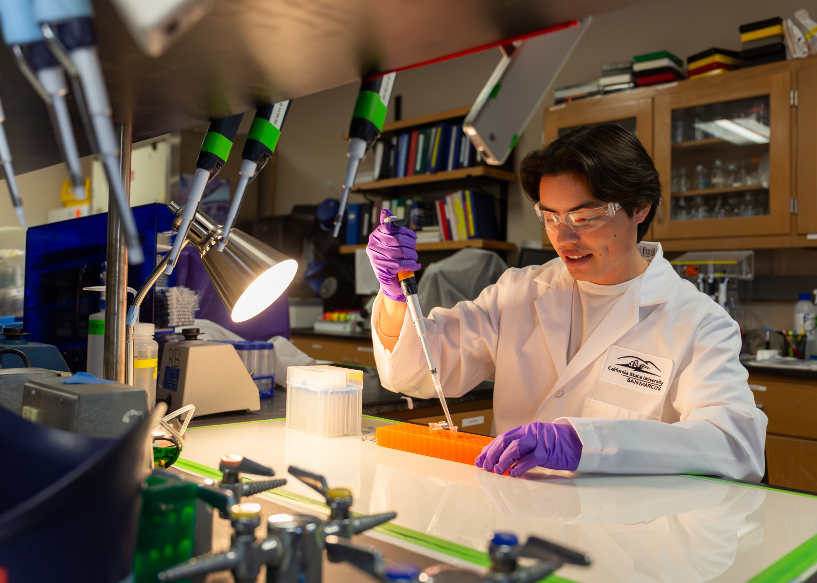 Cristian Alvizo, a biology student, is eager to graduate as he plans to apply for medical school next summer to become a urologist. Photo by Kirra Robusto Cristian Alvizo, a biology student, is eager to graduate as he plans to apply for medical school next summer to become a urologist. Photo by Kirra Robusto