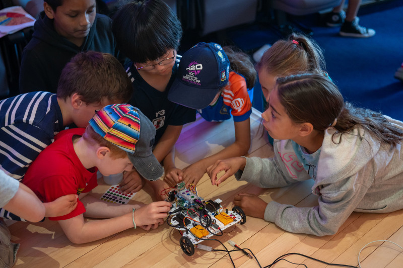 Pupils play with robot car at Camden Primary Careers Day 2026. Photo credit Sam Lane
