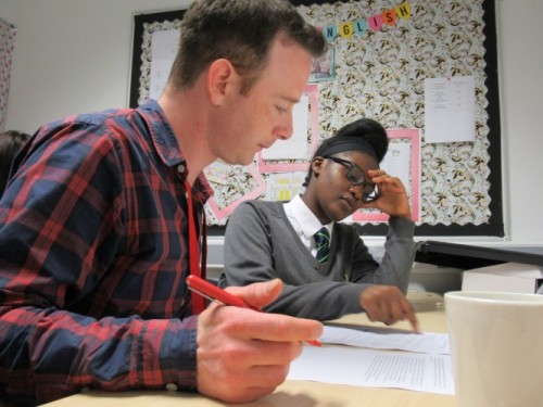 A teacher and student sat together