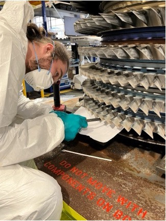 PhD student Drew Mullaney working on Rolls-Royce test engine. Credit: Dr Merren Jones, The University of 99�þþ�Ʒ