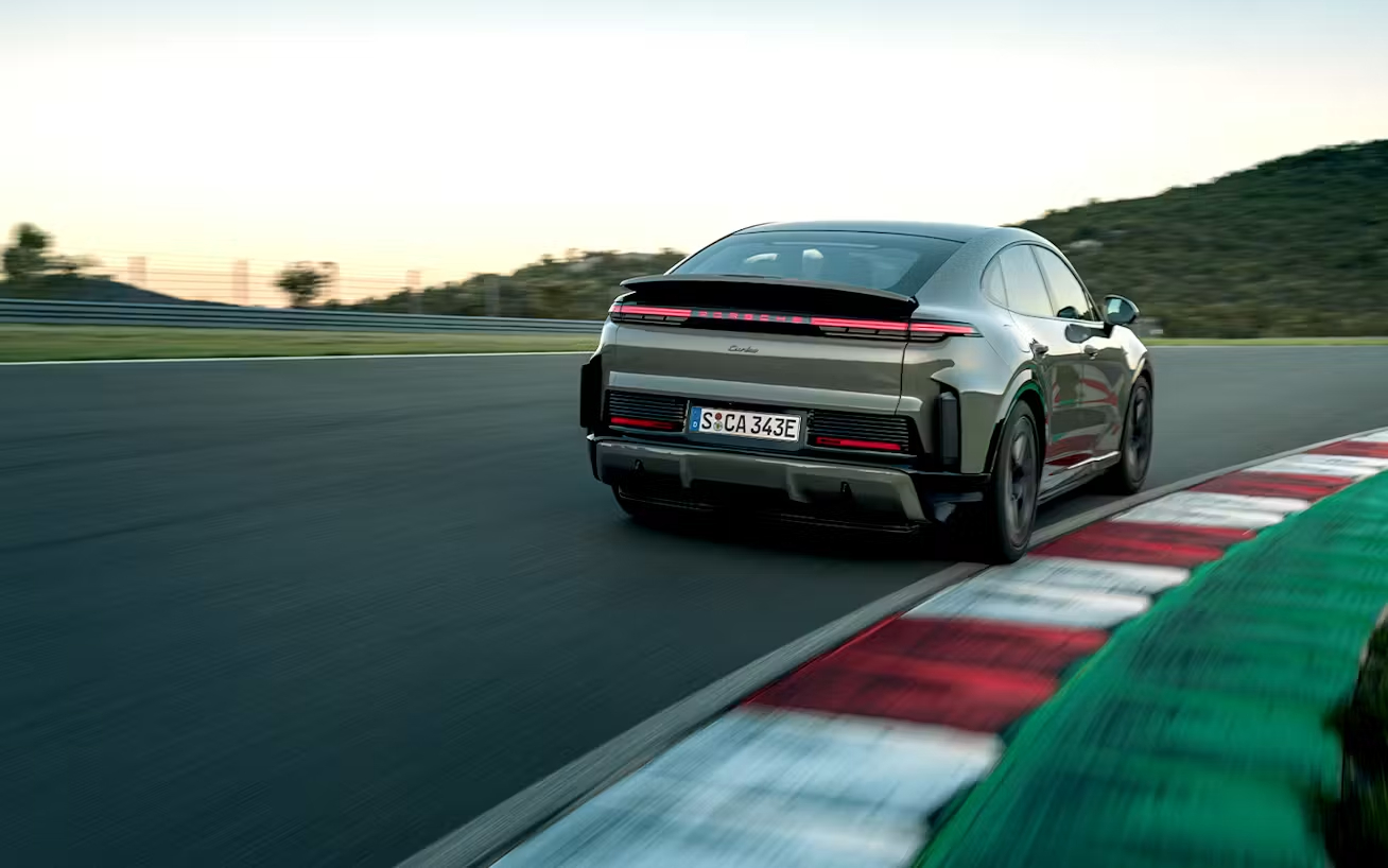 Rear_view_of_Cayenne_Turbo_CoupeÌ__Electric_cornering_on_racetrack