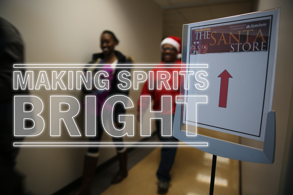 Sign Pointing to the Santa Store, says Making Spirits Bright