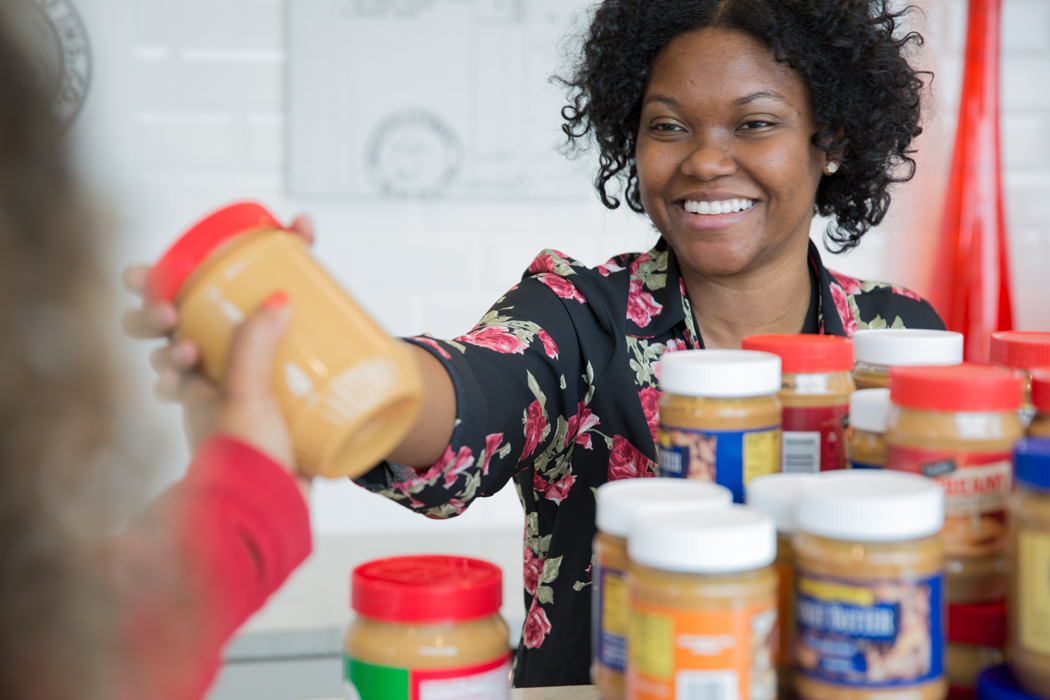 Kandace Waddy adding a jar of peanut butter to the collection.