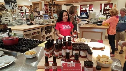 Kayla with the products at a local taste testing