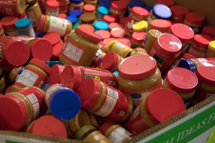A large collection of peanut butter jars.