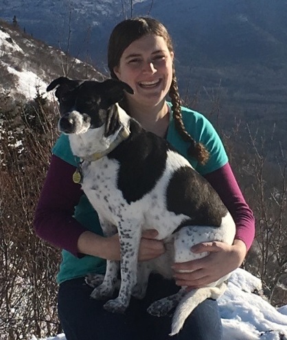 Ellen and her Blue Heeler Annie pose for a picture in the mountains.