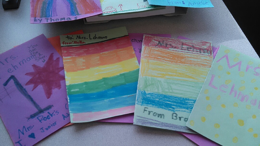an array of hand made cards on colored paper and colored decorations on the front of the cards addressed to Mrs. Lehman