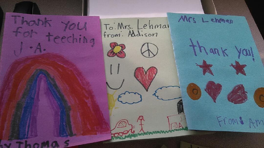 hand made thank you cards made my children on colored paper addressed to Mrs Lehman with picture drawn on the card of rainbow, flowers and hearts