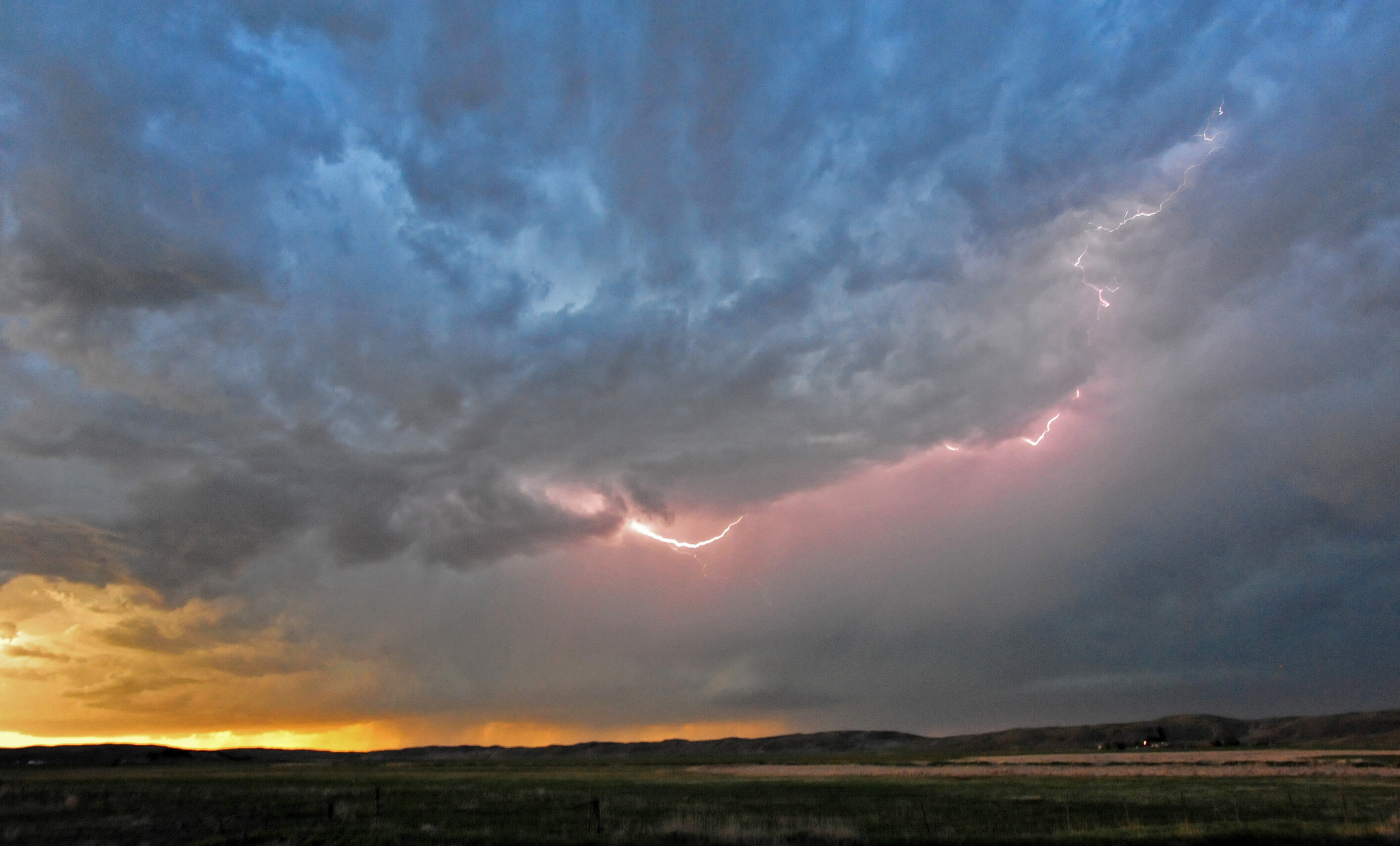 clouds and lightning approach on a horizon