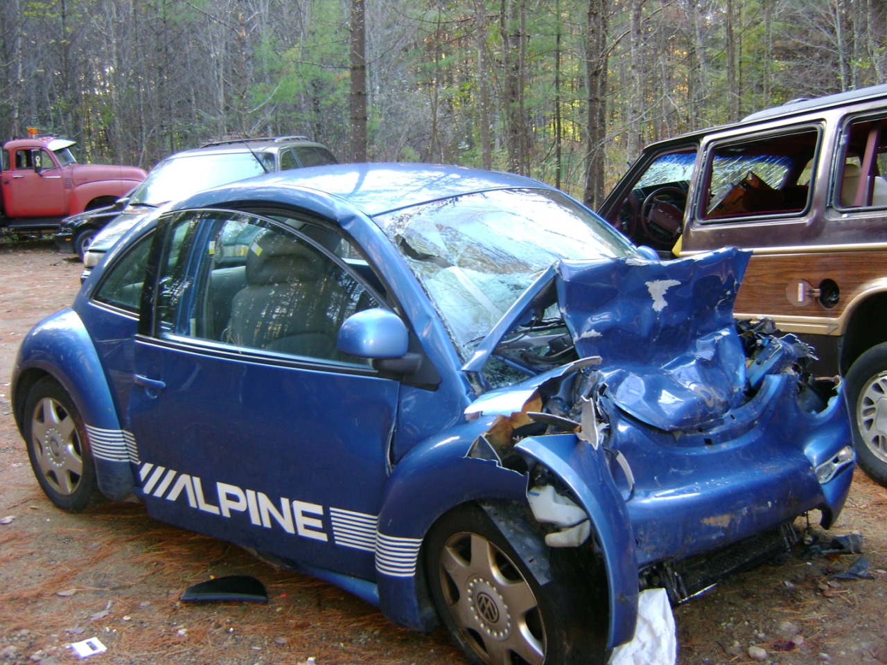 Blue Volkswagon bug smashed up due to a car crash